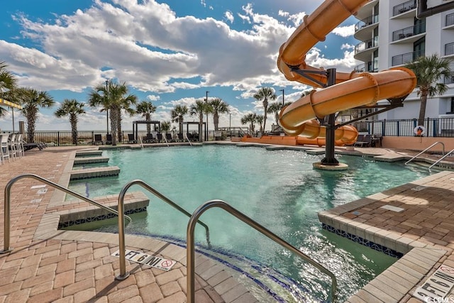 view of pool with a water slide