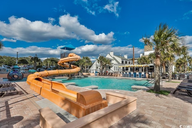 view of pool featuring a water slide