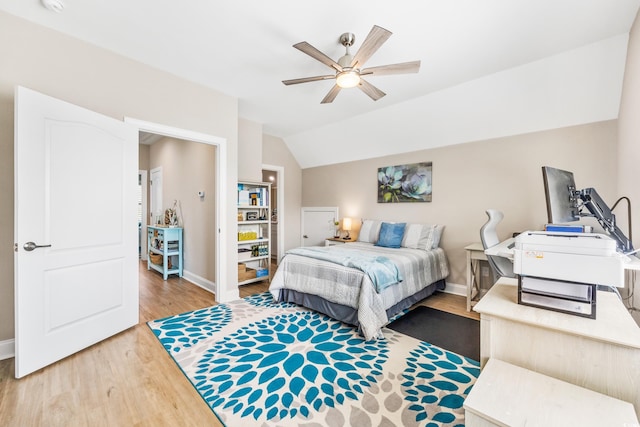 bedroom featuring wood-type flooring, ceiling fan, and vaulted ceiling