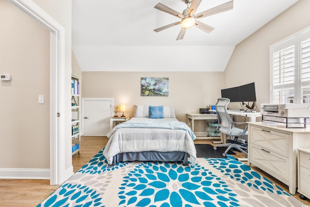 bedroom with lofted ceiling, ceiling fan, and hardwood / wood-style flooring