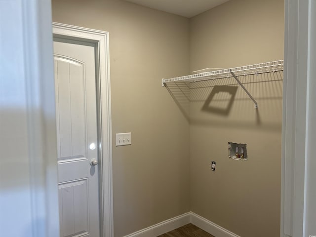 laundry room featuring hookup for a washing machine and hardwood / wood-style flooring