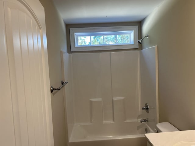 full bathroom with vanity, toilet, and shower / tub combination