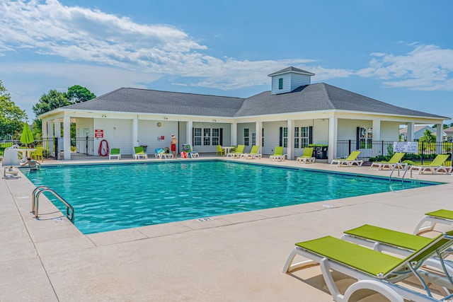 view of swimming pool with a patio