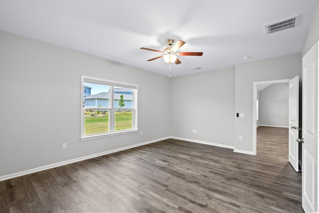 unfurnished room with dark wood-type flooring and ceiling fan