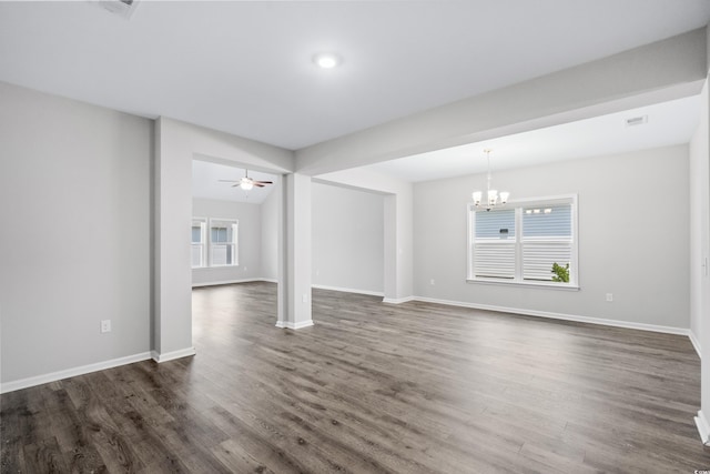 interior space featuring dark hardwood / wood-style flooring and ceiling fan with notable chandelier