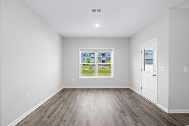 interior space featuring a healthy amount of sunlight and dark hardwood / wood-style flooring