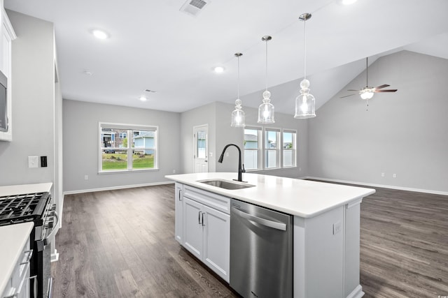 kitchen with white cabinetry, appliances with stainless steel finishes, dark hardwood / wood-style flooring, sink, and an island with sink