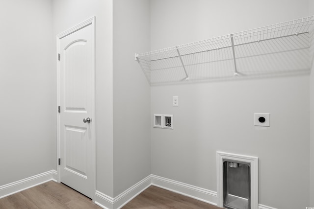 laundry area featuring hookup for a washing machine, hardwood / wood-style floors, and electric dryer hookup