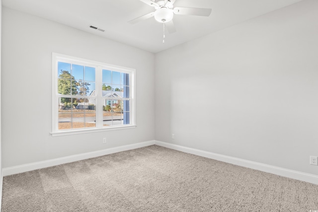 carpeted empty room with ceiling fan