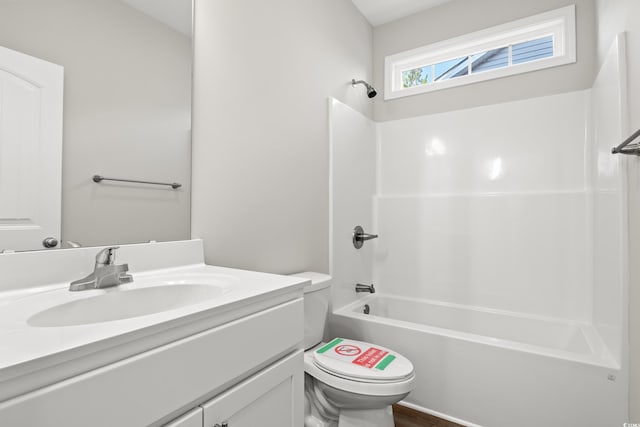 full bathroom featuring shower / bathing tub combination, vanity, and toilet