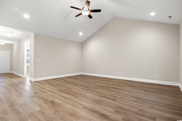 unfurnished living room with ceiling fan, lofted ceiling, and light hardwood / wood-style flooring