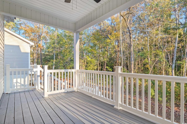 wooden deck featuring ceiling fan