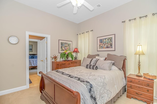 bedroom with light colored carpet and ceiling fan