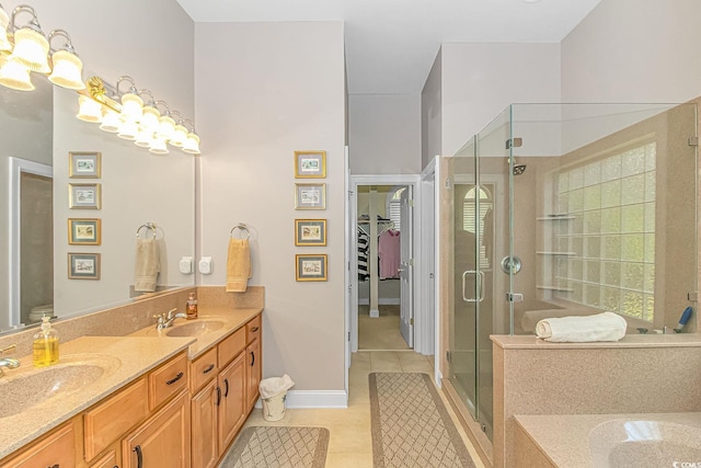 bathroom with vanity, an inviting chandelier, tile patterned floors, and an enclosed shower