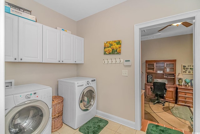 clothes washing area featuring separate washer and dryer, ceiling fan, light tile patterned floors, and cabinets