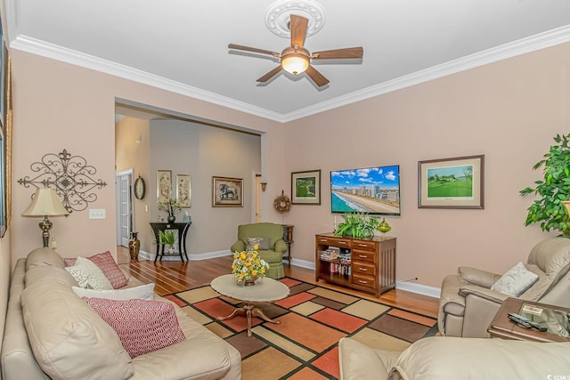 living room featuring light wood-type flooring, ceiling fan, and ornamental molding