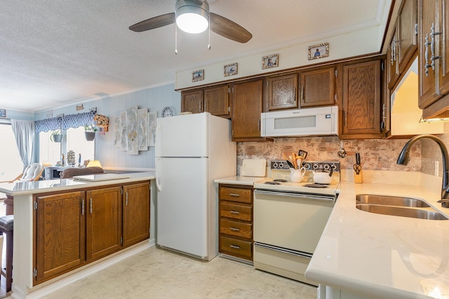 kitchen with ceiling fan, white appliances, a textured ceiling, light tile floors, and sink