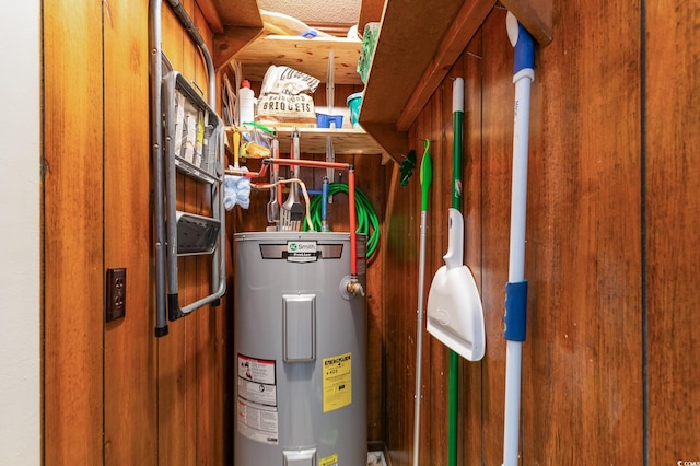 utility room featuring water heater