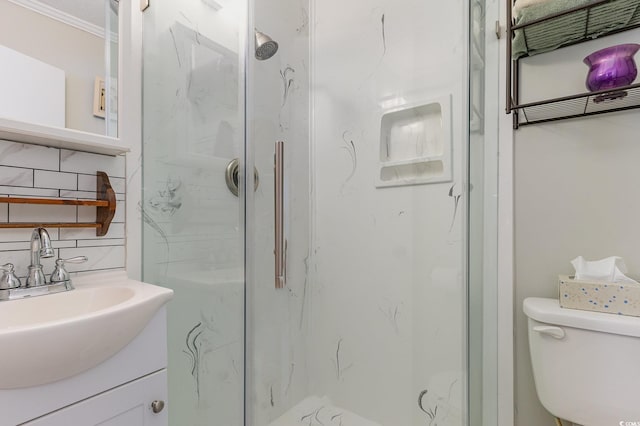 bathroom with crown molding, tasteful backsplash, an enclosed shower, toilet, and vanity