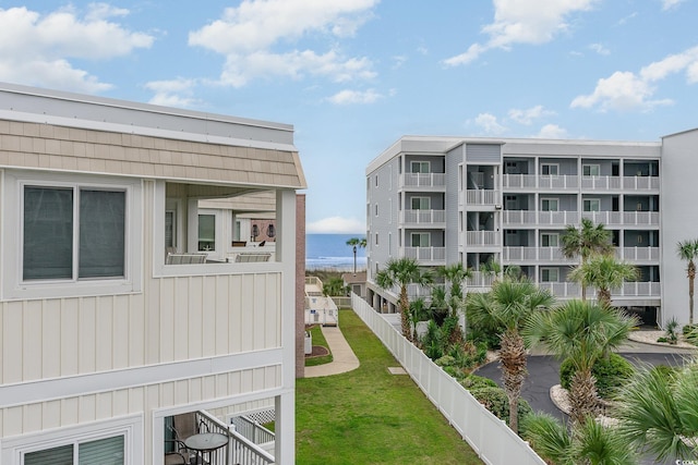 view of nearby features with a water view and a lawn