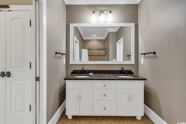 bathroom with tile patterned flooring, vanity, crown molding, and walk in shower