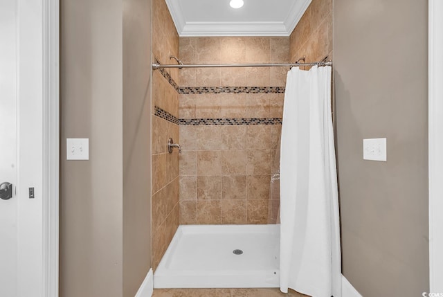 bathroom with crown molding and a shower with shower curtain