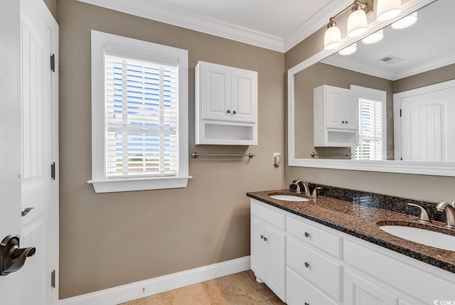 bathroom with plenty of natural light, crown molding, and vanity