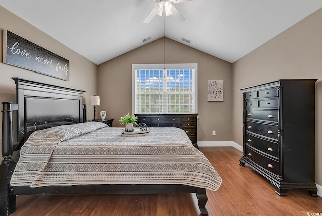 bedroom with ceiling fan, lofted ceiling, and hardwood / wood-style flooring