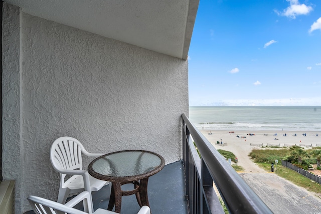 balcony with a view of the beach and a water view