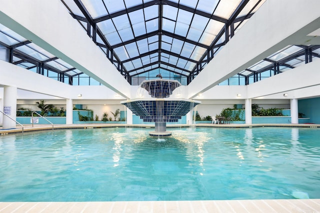 view of swimming pool with a patio and pool water feature