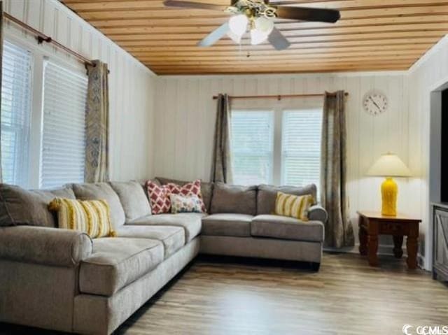 living room featuring wooden ceiling, light wood-type flooring, and ceiling fan