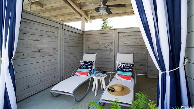 view of patio featuring ceiling fan