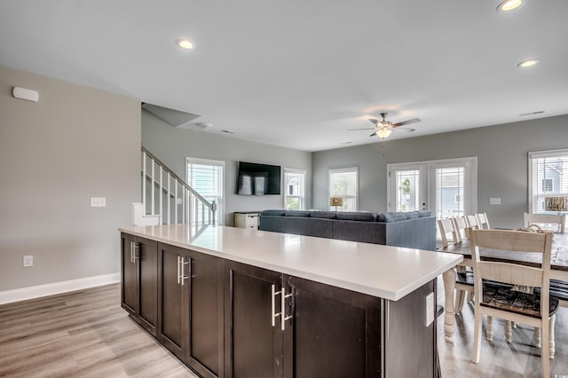 kitchen with visible vents, appliances with stainless steel finishes, dark wood finished floors, a sink, and white cabinets