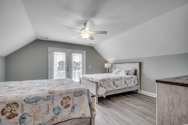 living area with stairway, ceiling fan, wood finished floors, and a wealth of natural light