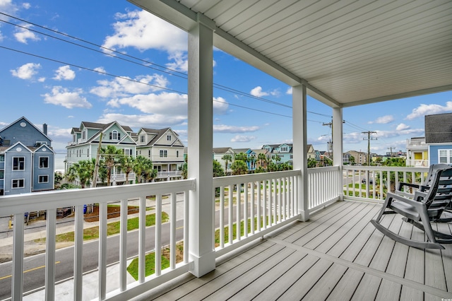 wooden deck with a residential view