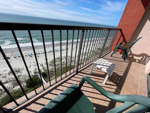 balcony with a view of the beach and a water view