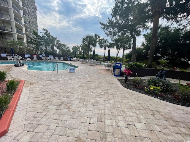 community pool with a patio