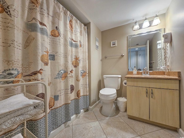 bathroom with toilet, walk in shower, tile patterned flooring, and vanity