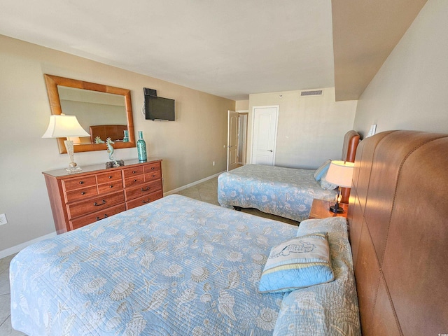 bedroom featuring light tile patterned floors