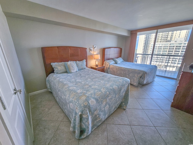 tiled bedroom featuring access to exterior