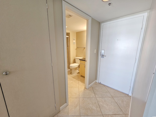 hallway featuring light tile patterned flooring