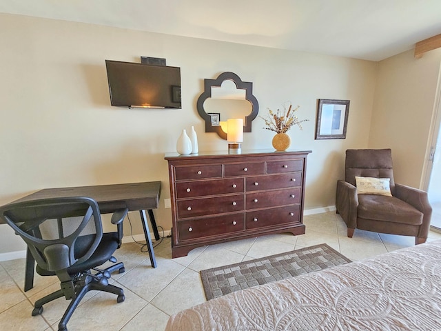 bedroom with light tile patterned floors