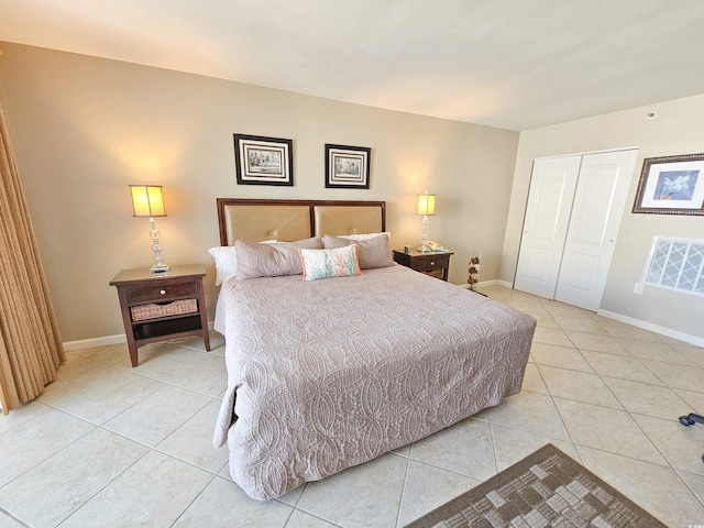 tiled bedroom featuring a closet