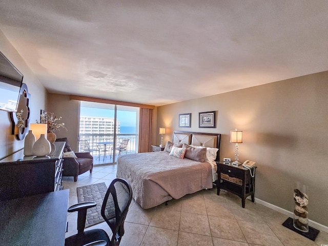 bedroom featuring light tile patterned flooring, access to exterior, and floor to ceiling windows