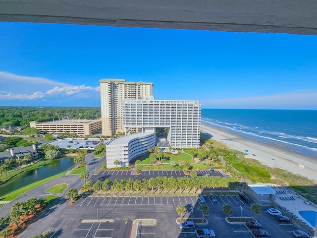 bird's eye view featuring a view of the beach and a water view