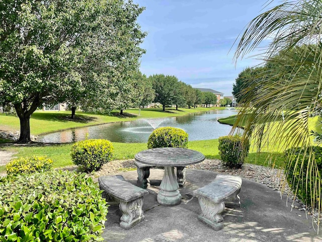 view of terrace with a water view