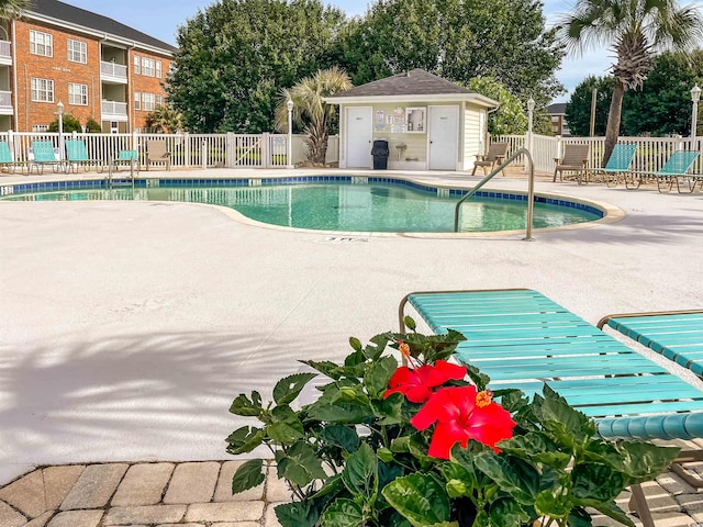 view of swimming pool with a patio