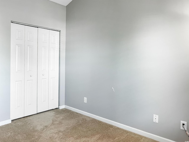 unfurnished bedroom featuring a closet and carpet