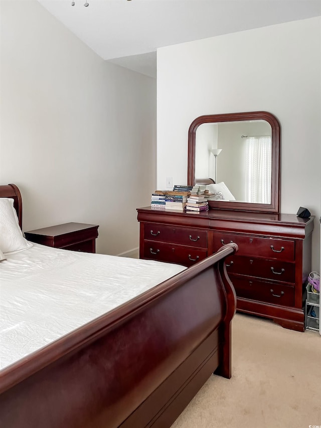 bedroom with light colored carpet