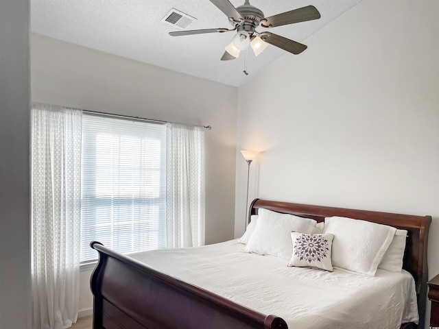 bedroom with vaulted ceiling and ceiling fan